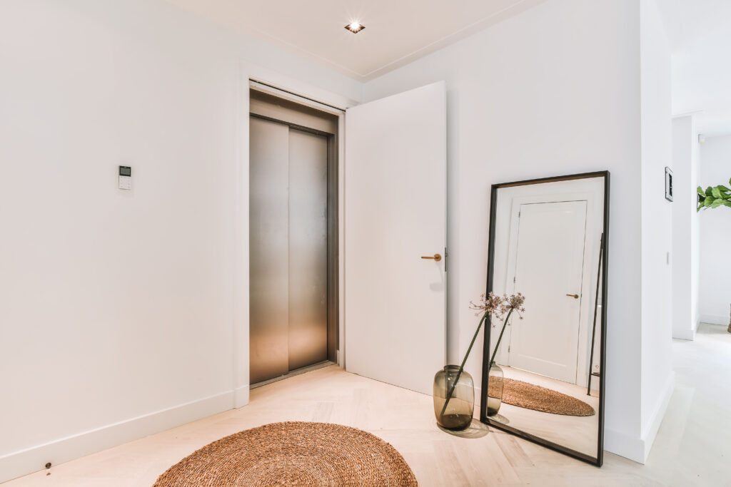 Elevator door with standard door open showing it